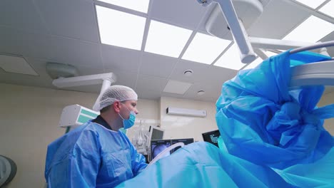 hard working doctor during operating. professional surgeon performing surgery on a patient in the hospital operating room
