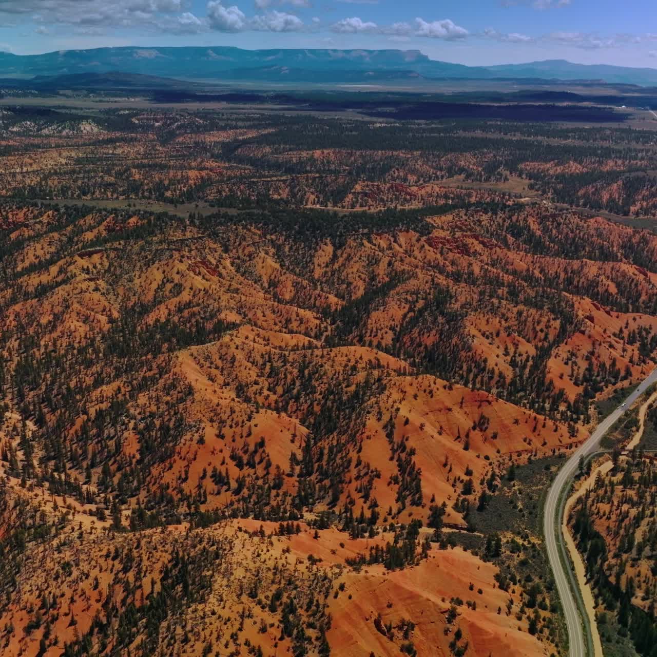Stunning mountainous panorama of Zion National Park, Utah, USA. Long motorway going through vast territory of park. Aerial perspective