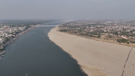 high-angle view capturing the vibrant life of varanasi's riverfront, where the ancient city pulses with energy and devotion.