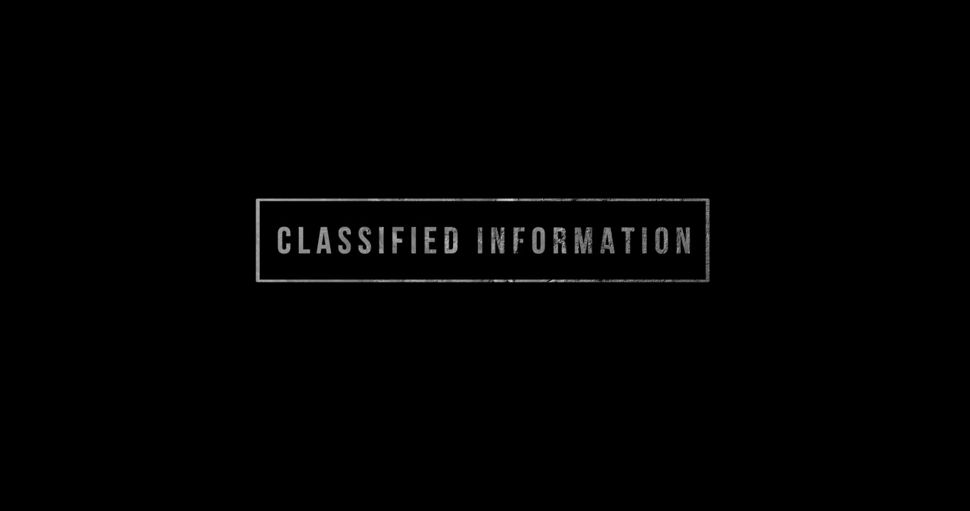Stamp with the word Classified moving into the frame on black background