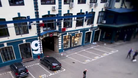 urban courtyard with parking and shops