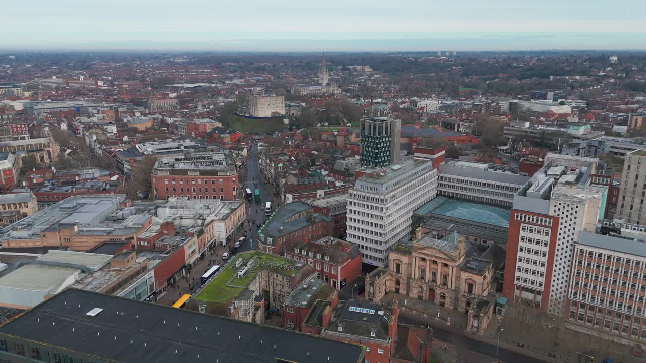 Norwich city center with shops, streets, and historic churches visible , aerial view