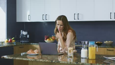 business woman checking email. thinking female freelancer working on computer.