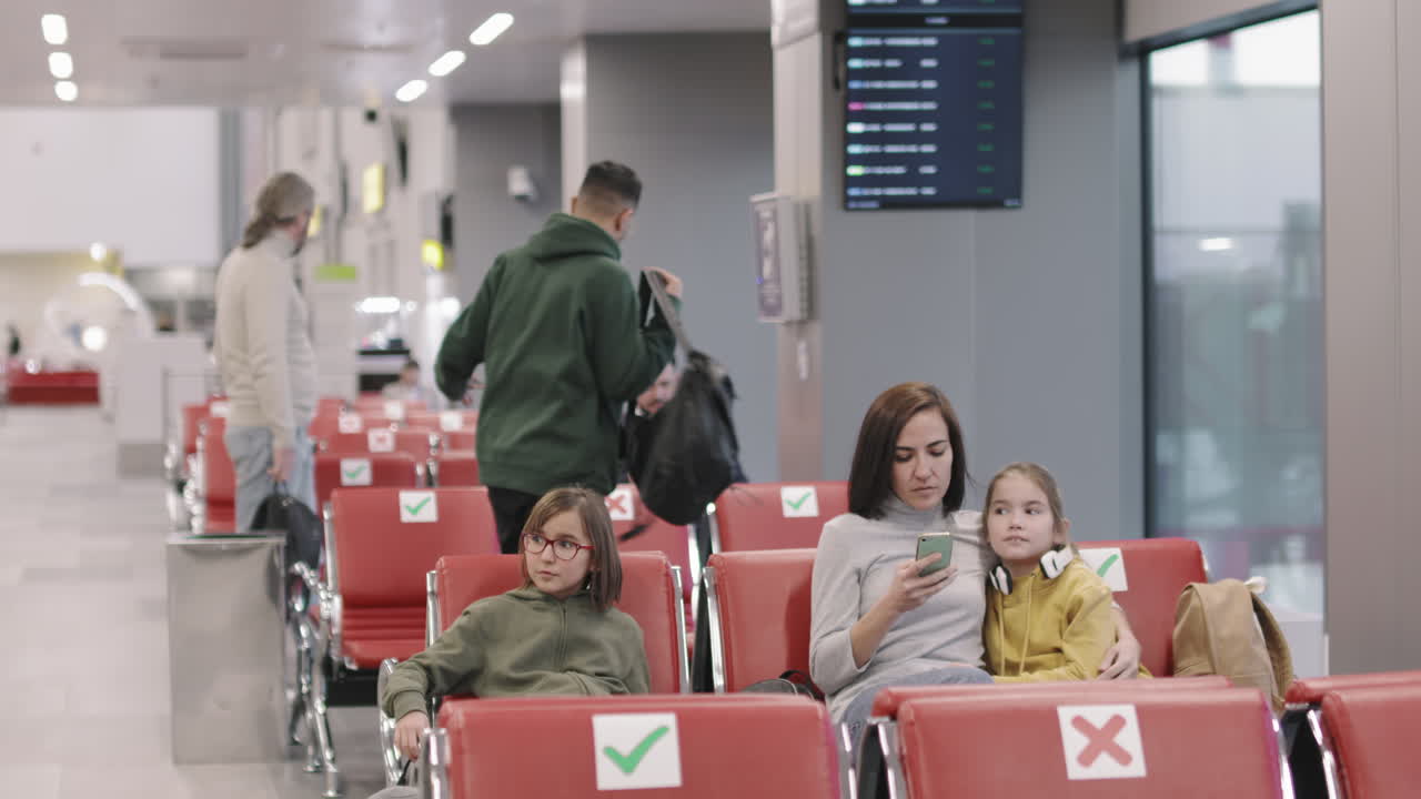 Passengers Waiting In Departure Lounge