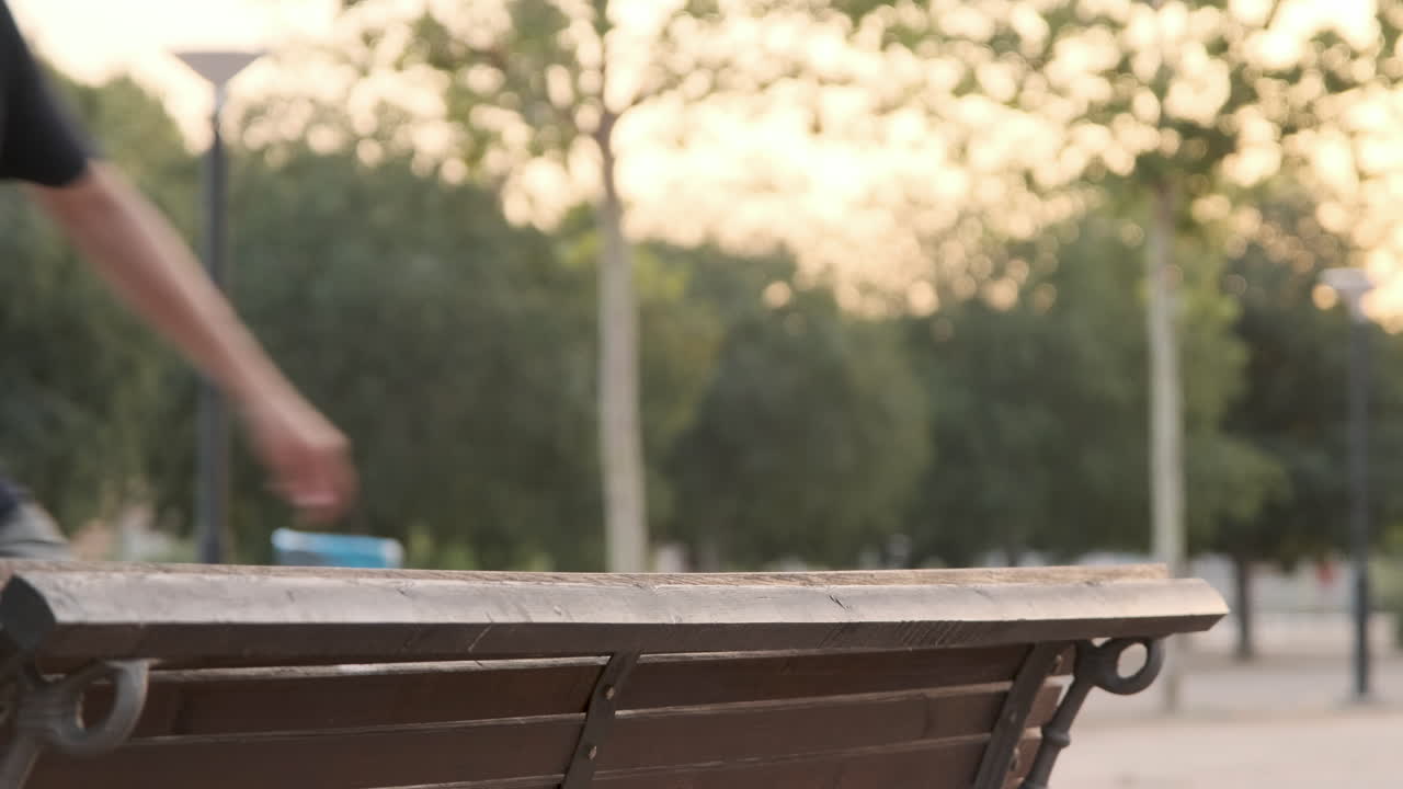 Boxer dog jumping and riding with his owner in the park at sunset, slow motion video