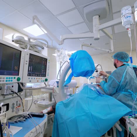 group of surgeons in operating room with surgery equipment. operating room with x-ray medical scan.
