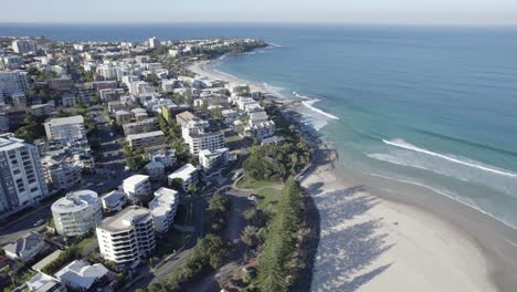 aerial view over kings beach coastal suburb in the sunshine coast region, queensland, australia - drone shot