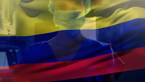 Animation-of-colombia-flag-over-portrait-of-caucasian-female-surgeon-in-surgical-mask-at-hospital