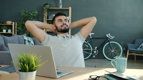 man relaxing at home office