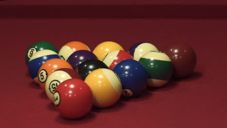 close up slow motion shot of billiard balls being struck