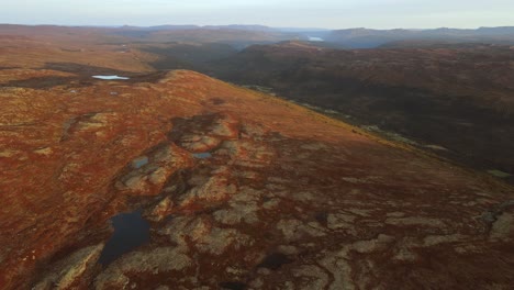 Mountainous-area-with-valley,-lakes-and-geological-formations-in-Southern-Norway