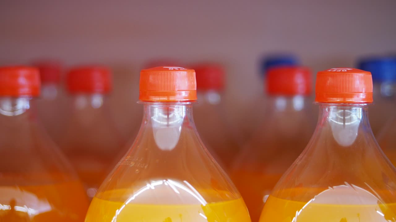 Close-up of Orange Soda Bottles