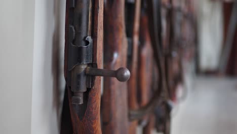 old rifles hanging on a wall