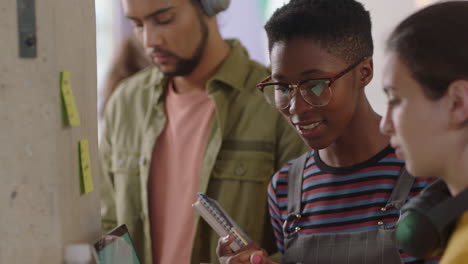 young-business-people-brainstorming-african-american-team-leader-woman-showing-support-helping-colleagues-sharing-ideas-using-laptop-computer-in-modern-office-workplace