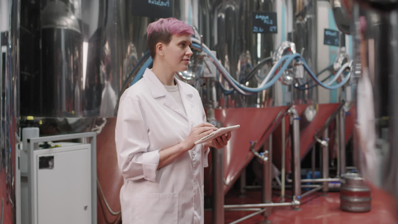 Portrait Of Female Brewery Inspector In Lab Coat