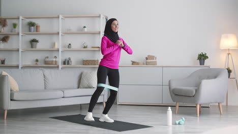 woman doing leg exercises at home with resistance band