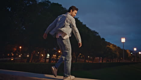 carefree tourist enjoy evening in town park. happy latin man walking on railings