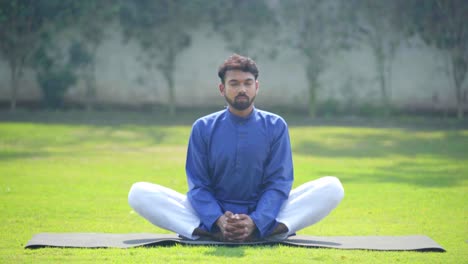 indian man doing butterfly yoga