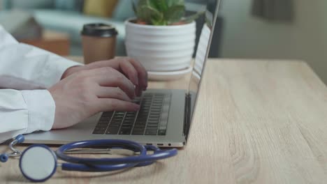 hands male doctor typing on laptop computer , video in 4k