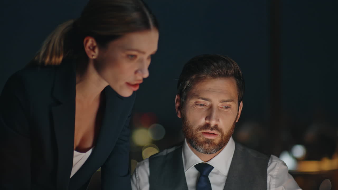 Office partners working late solving business problem. Closeup boss discussing