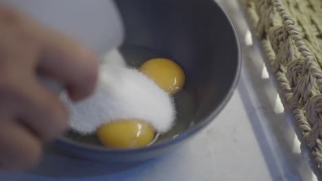 adding sugar to eggs for baking