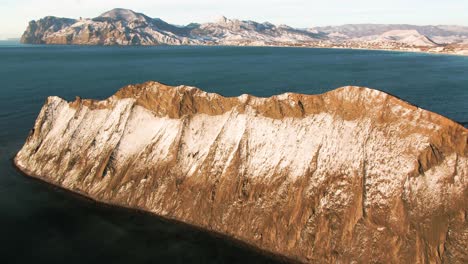 snowy mountain coastline