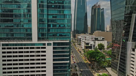 panama city aerial v81 cinematic low altitude tracking shot across streets and avenues capturing high rise buildings in obarrio and downtown neighborhoods - shot with mavic 3 cine - march 2022