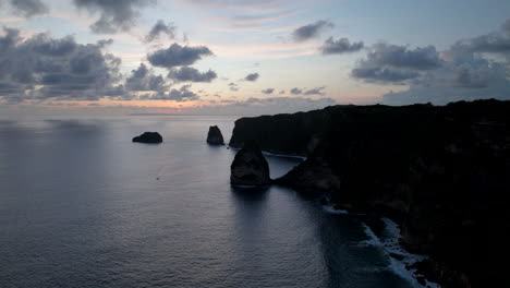 high cliffs of nusa penida at sunset, bali in indonesia