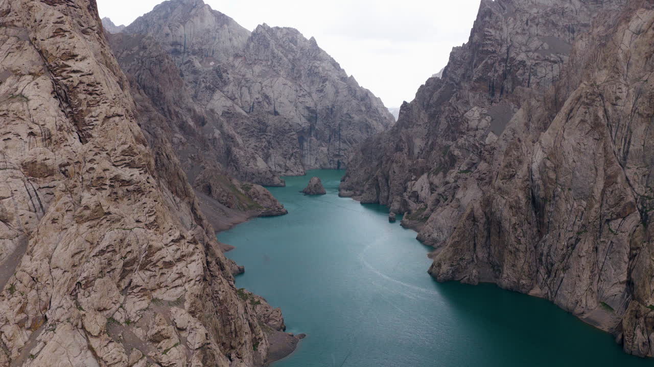 Aerial View Of Kel Suu Lake In The Highlands Of Kyrgyzstan - Drone Shot