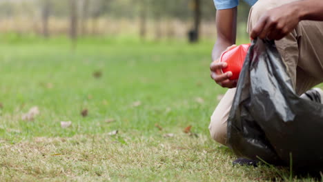 Man,-hands-and-volunteer-with-bag-for-community