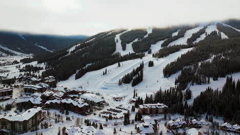 foggy cloud layer winter snowy early morning sunrise aerial drone copper mountain colorado ski resort i70 eagle flyer lift center village snowboarding half pipe ikon epic pass circle left