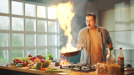 man cooking vegetables in a kitchen