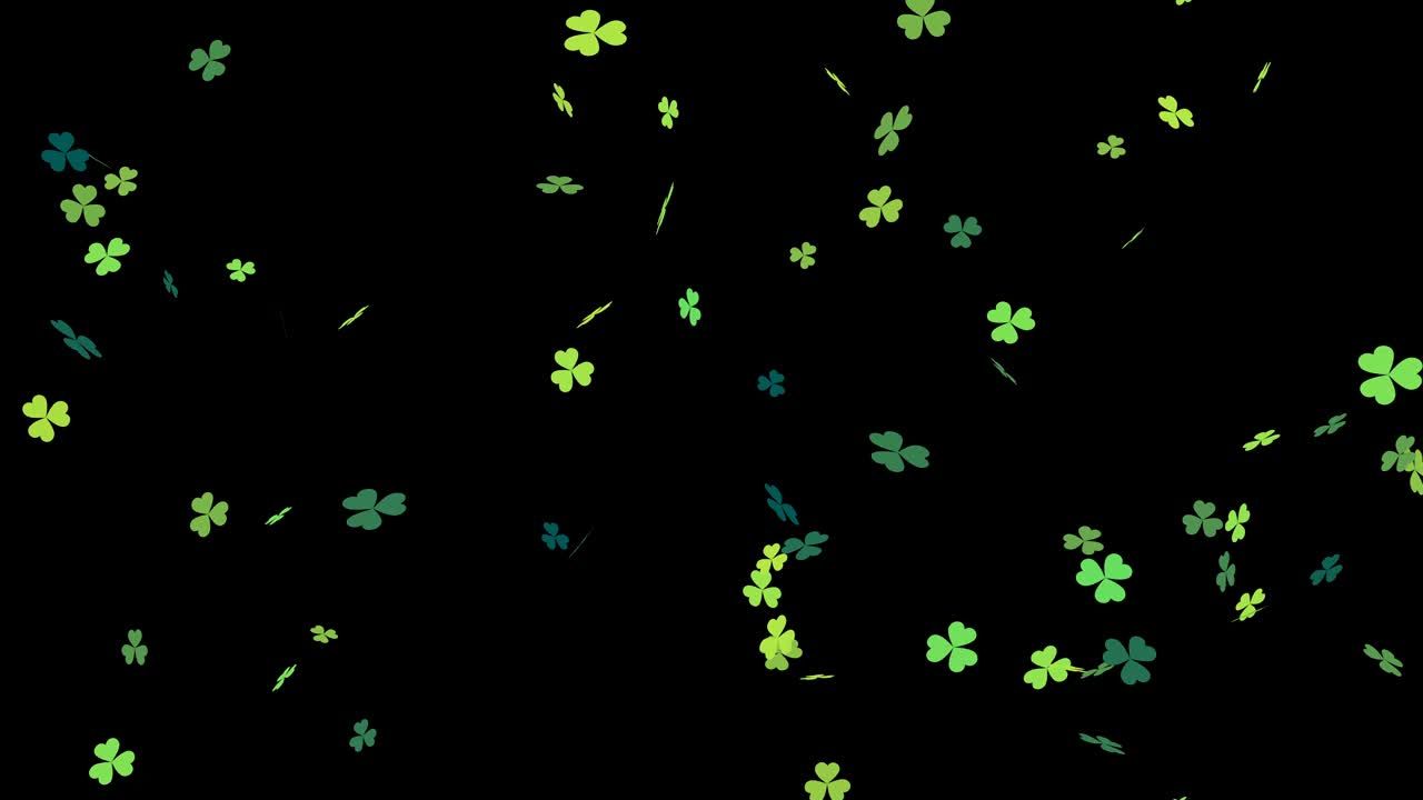 hojas de trébol verdes cayendo sobre un fondo negro en bucle