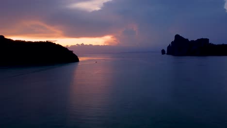 tropical storm brewing: lighting and thunder flashing in the clouds on horizon