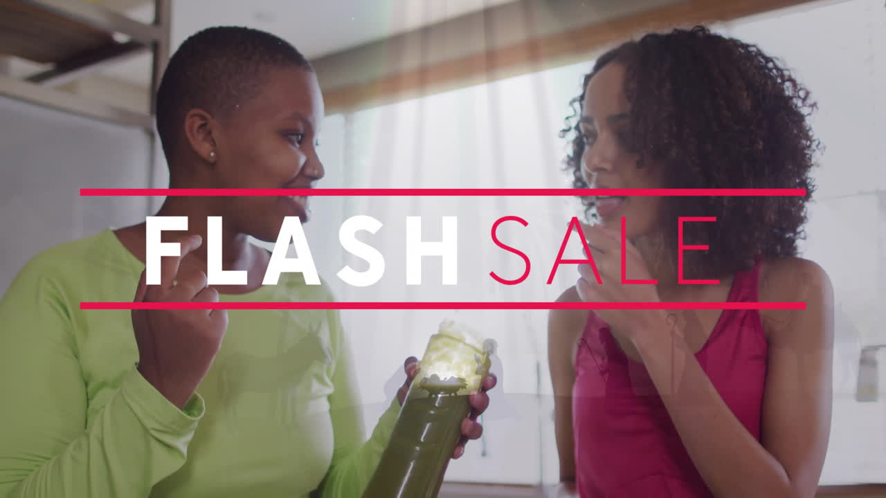 Discussing over green juice, two women with FLASH SALE animation overlay
