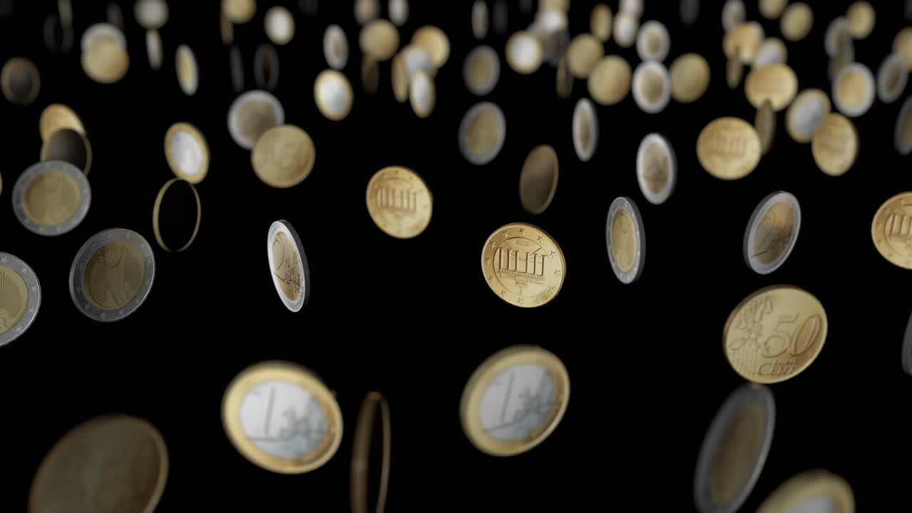 Dancing &euro; coins.
Black background. Depth of field