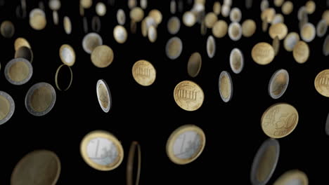 dancing € coins.
black background. depth of field