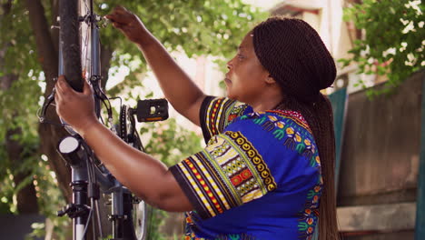 Woman-fastening-bike-bolts-and-wheel