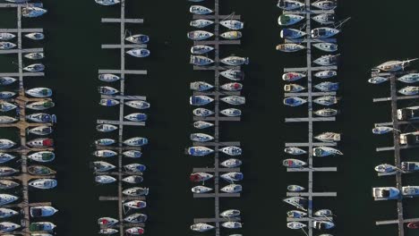 a top-down view captures the marina with boats moored at the whitby yacht sailing club in ontario, canada