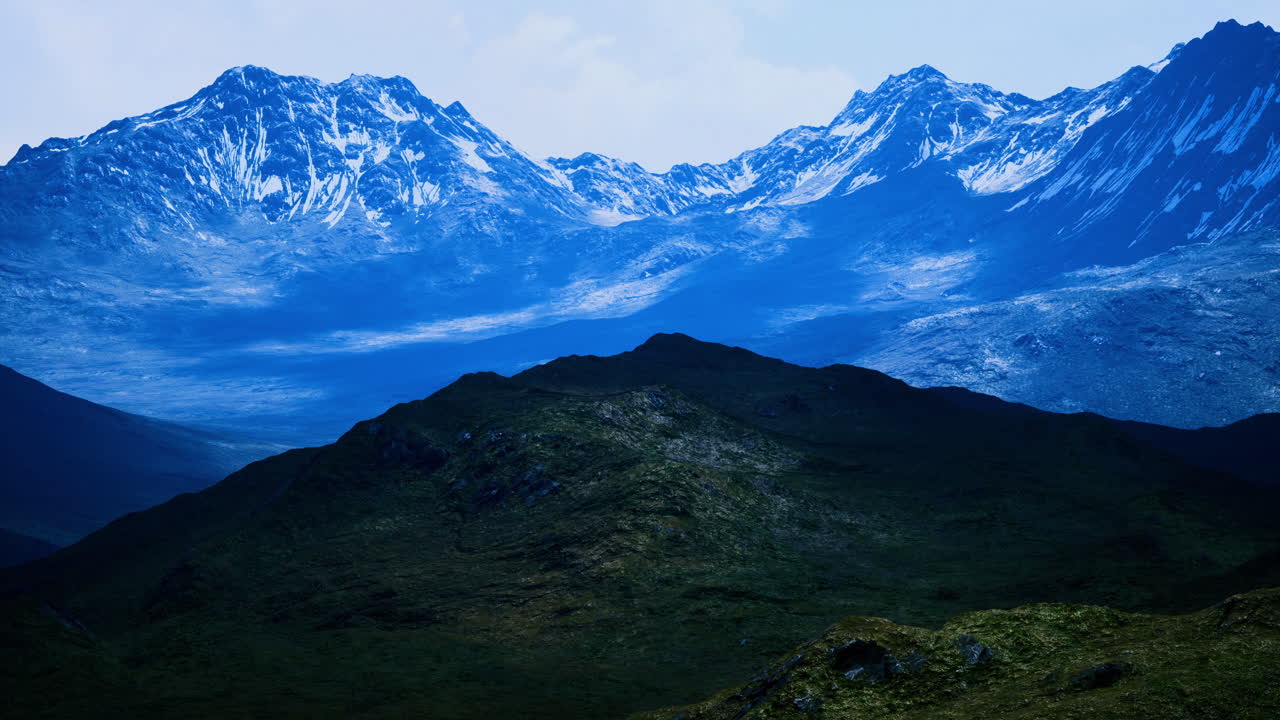 Majestic mountain landscape under a serene blue sky at dusk