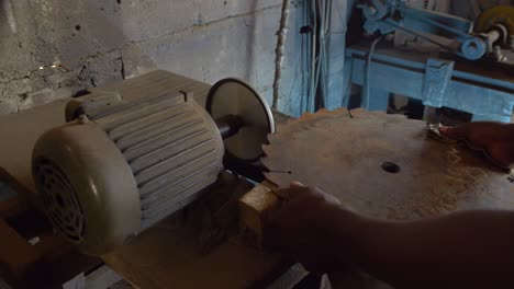 close up of skilled black male labor working class hands working in a metallurgic factory in africa