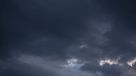 Time-Lapse-Looking-Up-At-Clouds-Going-Past-Turning-Daytime-To-Dark