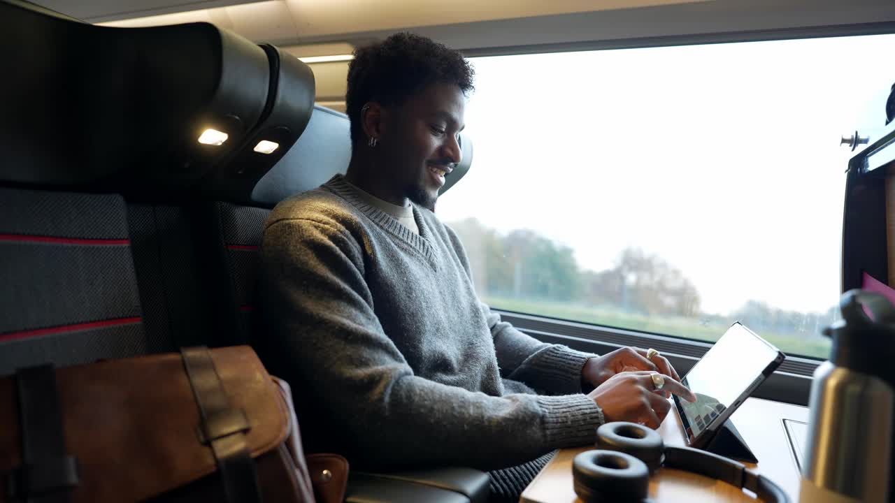 Man using tablet on a train