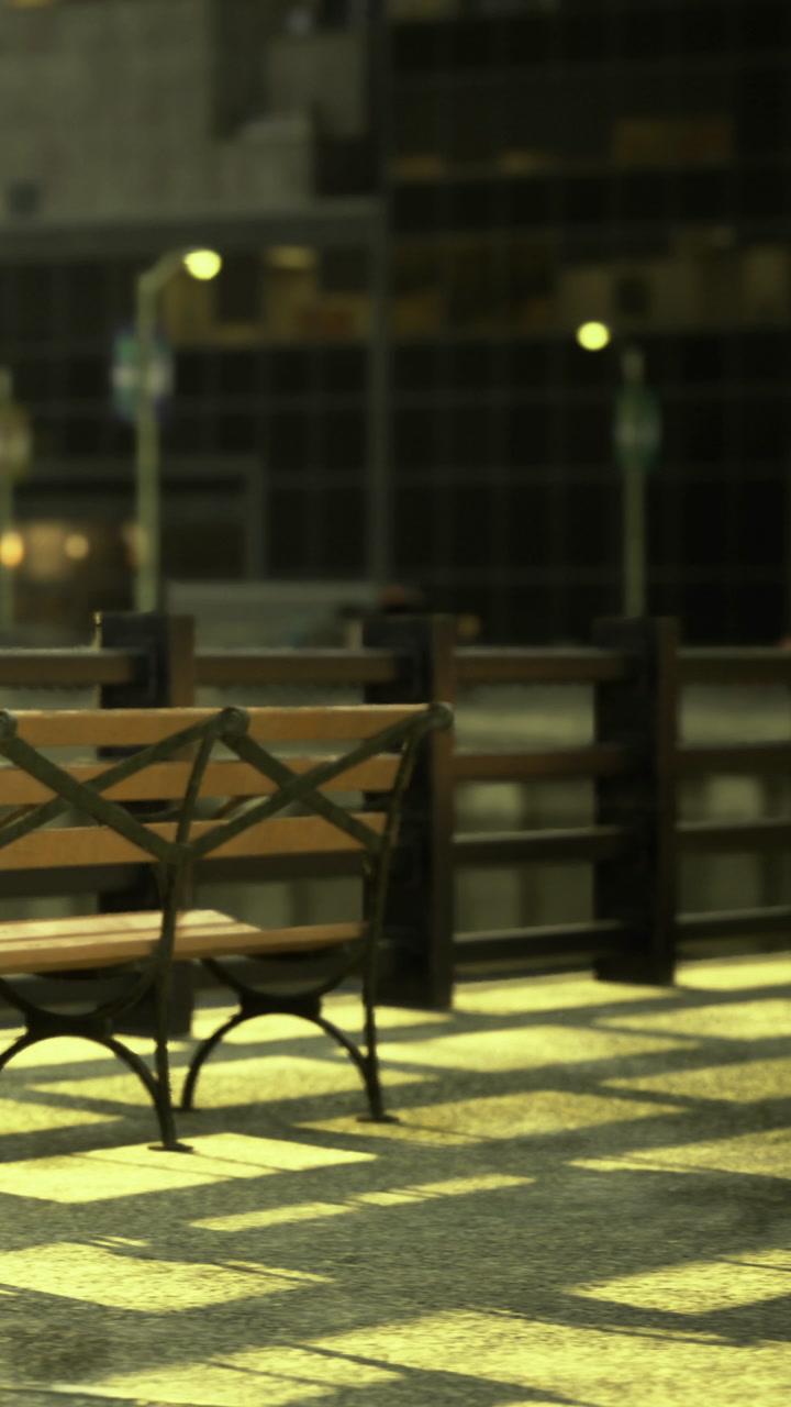 Evening scene at a quiet outdoor cafe with empty tables and chairs