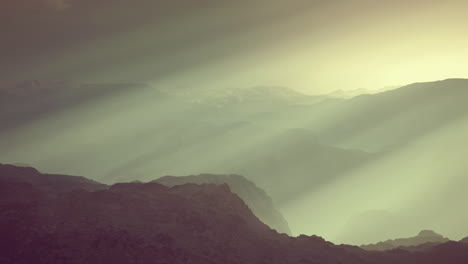 black rocky mountain silhouette in deep fog
