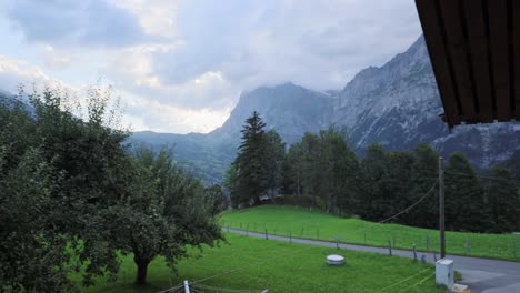 Eiger-Mountain-View-Straight-Out-of-Traditional-House-Door-Cinematic-Reveal-Movement