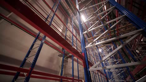 big and modern warehouse under construction, featuring metal shelving and other industrial equipment.