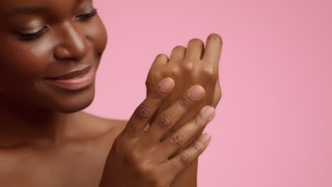 woman applying lotion or cream to her wrist