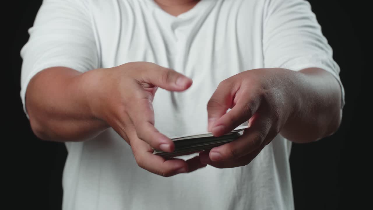 Man Shuffling Cards, Cardistry On Black Background