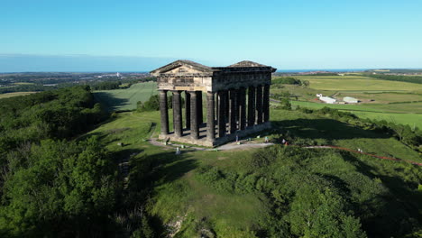 aerial wide cinematic, camera circles as family reach the top of penshaw monument in sunderland, north east, uk